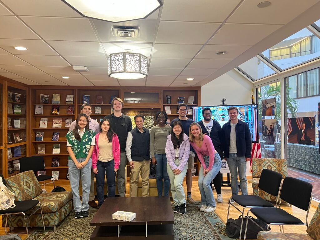 Students pose with IBD Alum Luis Garzon